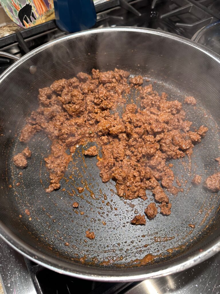 Finished taco seasoned ground beef in a skillet