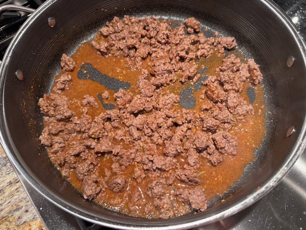 cooked ground beef plus 7 tsp of taco seasoning plus 3/4 C water cooking 