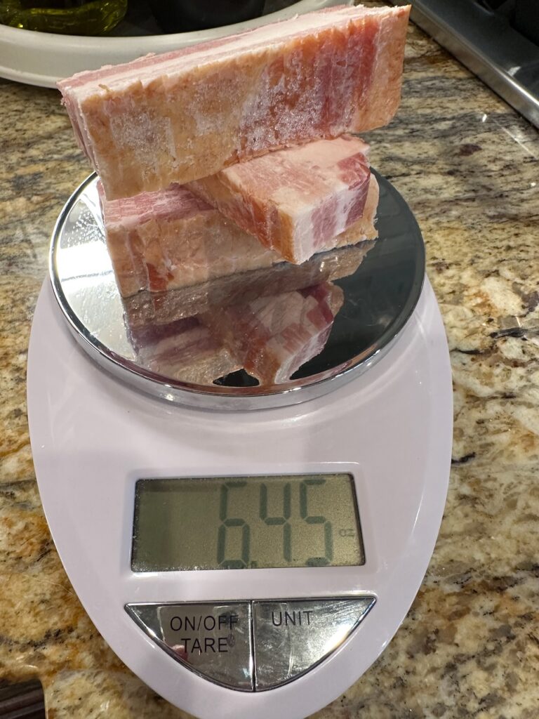 Measuring weight of frozen bacon