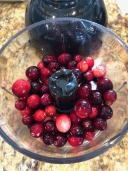 Process the cranberries a bit to break them up