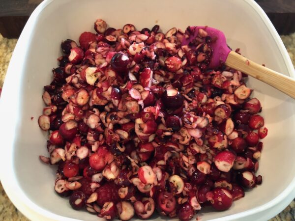 Drop 12 oz processed / chopped cranberries into the fruit mixture