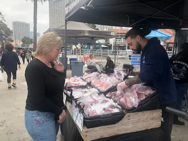 Me selecting fish at fish market