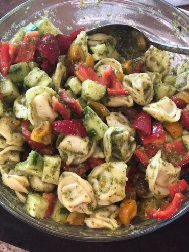 Cheese Tortellini salad with tomatoes, peppers, cucumbers, corn and basil vinaigrette