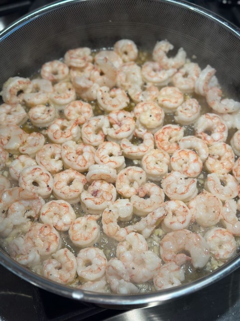 Cooking the shrimp in a large pan 