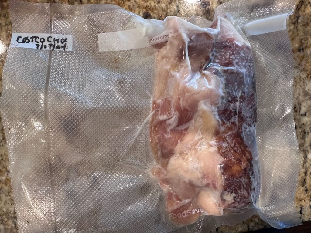 Frozen costco roasted chicken in a vacuum sealed bag 