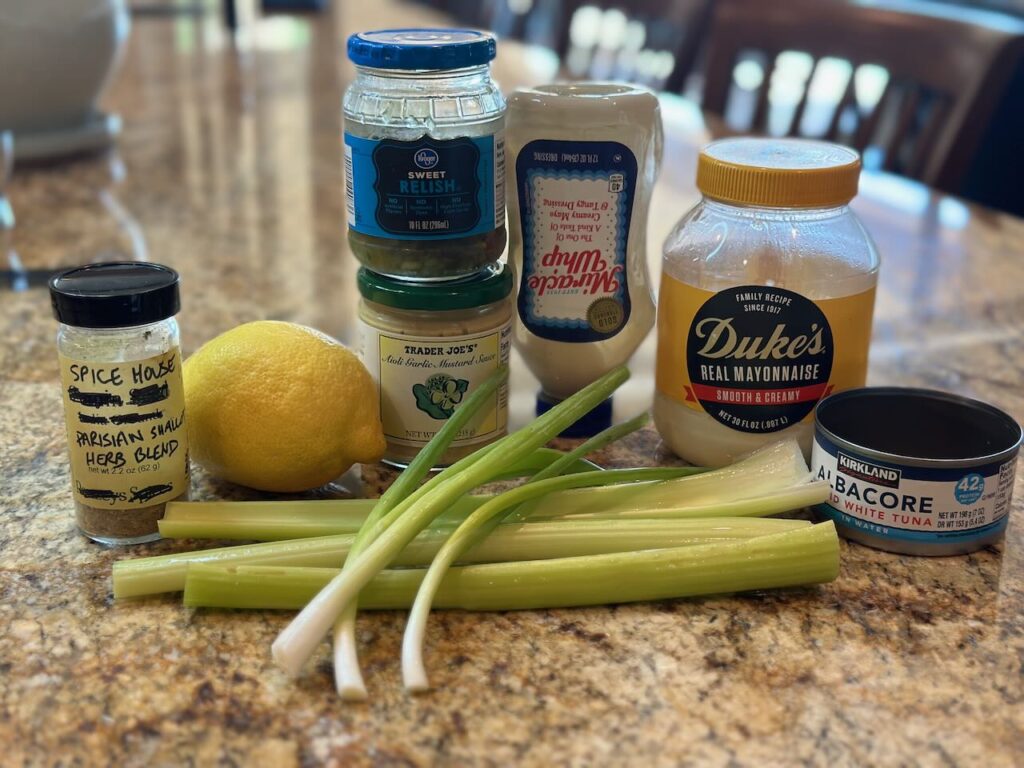 Ingredients for tuna salad - canned tuna in water, mayonnaise, Dijon or TJ's garlic Dijon aioli, pickle relish, lemon and spices/herbs.