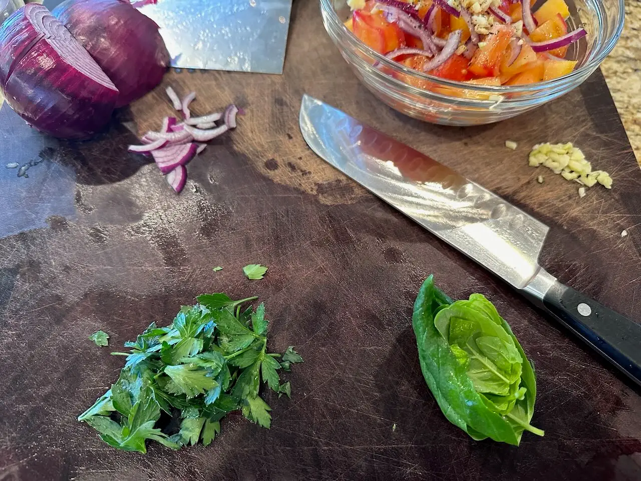 Stacking basil leaves in prep for basil chiffonade - needed for our heirloom tomato salad