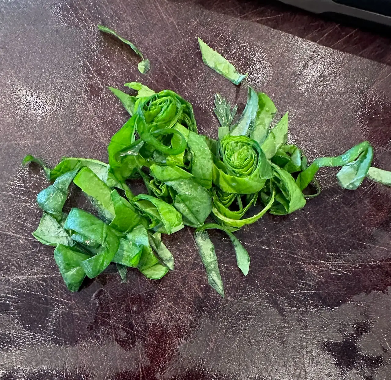 Chiffonade basil - for the heirloom tomato salad