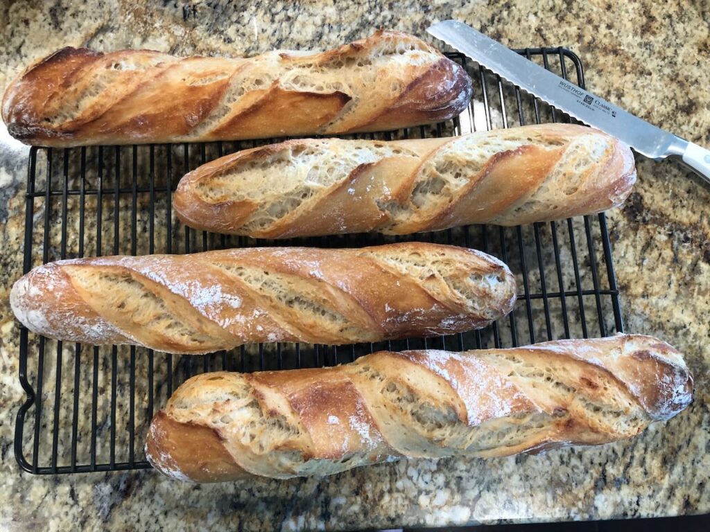 Picture of homemade baguettes baked without Diastatic Malt - they are beige in color 