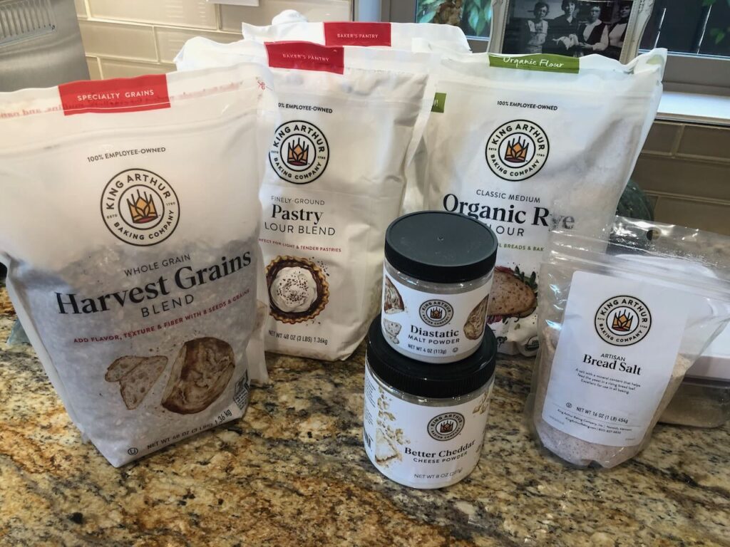 A picture of a bunch of grains / alternative ingredients purchased at king arthur flour before xmas on year