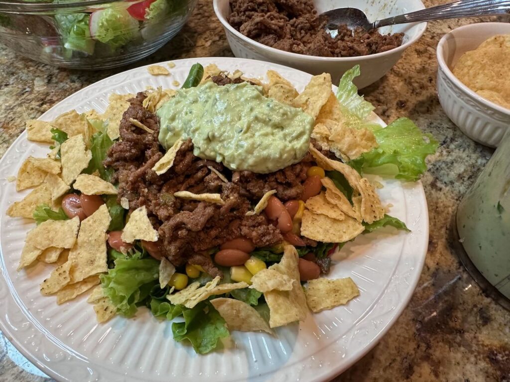 Easy, delicious and filling Taco Salad constructed but not tossed.