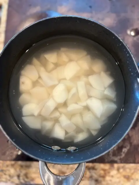 In the potatoes go to a pot of COLD Water 