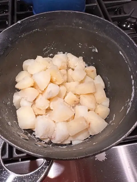 Potatoes done boiling with baking soda.  The outside of the potatoes are all craggy and have lots of nook and crannies now for oil and roasting to cruncy perfection 