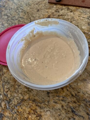 A lonely bowl of excellent creamy thick and delicious caesar salad dressing